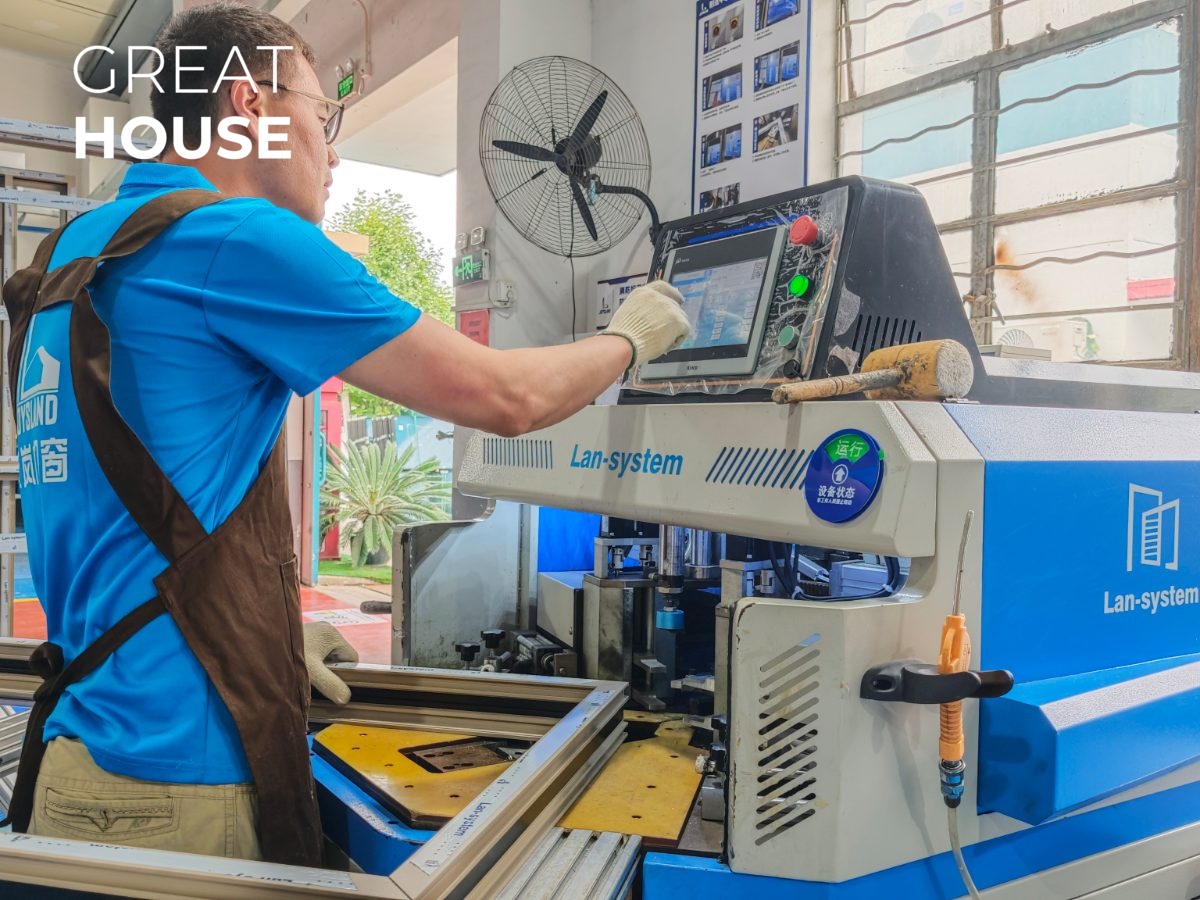 Operator setting the CNC corner crimping machine