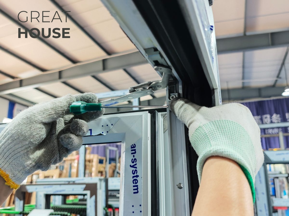 Technician adjusting a window hinge